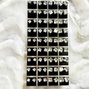Brand new 36 pair rhinestone earrings on stand Great for resale